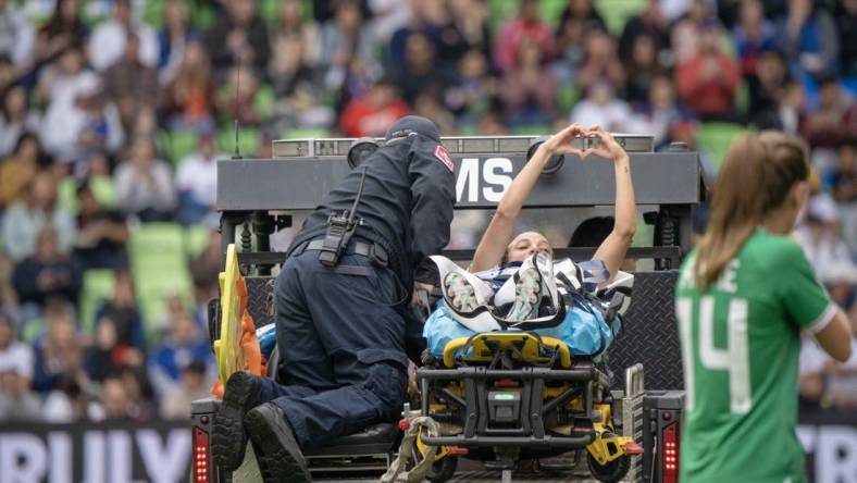 Apr 8, 2023; Austin, Texas, USA; U.S. Women's National Team forward Mallory Swanson (9) is escorted off field by medical personnel during the first half in a match against the Republic of Ireland Women's National Team at Q2 Stadium. Mandatory Credit: Dustin Safranek-USA TODAY Sports