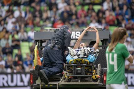 Apr 8, 2023; Austin, Texas, USA; U.S. Women's National Team forward Mallory Swanson (9) is escorted off field by medical personnel during the first half in a match against the Republic of Ireland Women's National Team at Q2 Stadium. Mandatory Credit: Dustin Safranek-USA TODAY Sports