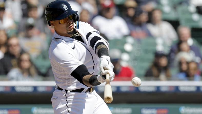 Apr 9, 2023; Detroit, Michigan, USA;  Detroit Tigers shortstop Javier Baez (28) hits a single in the third inning against the Boston Red Sox at Comerica Park. Mandatory Credit: Rick Osentoski-USA TODAY Sports