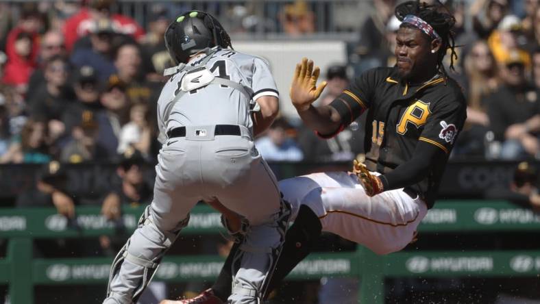 Apr 9, 2023; Pittsburgh, Pennsylvania, USA; Chicago White Sox catcher Seby Zavala (44) tags Pittsburgh Pirates shortstop Oneil Cruz (15) out at home plate attempting to score during the sixth inning at PNC Park. Cruz suffered an apparent injury on the play and left the game. Mandatory Credit: Charles LeClaire-USA TODAY Sports