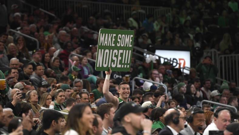 Apr 9, 2023; Boston, Massachusetts, USA; A fan holds a sign during the first half at TD Garden. Mandatory Credit: Bob DeChiara-USA TODAY Sports