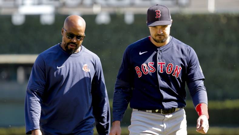 Apr 9, 2023; Detroit, Michigan, USA;  Boston Red Sox center fielder Adam Duvall (18) walks off the field with the trainer during the ninth inning against the Detroit Tigers at Comerica Park. Mandatory Credit: Rick Osentoski-USA TODAY Sports