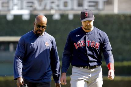 Apr 9, 2023; Detroit, Michigan, USA;  Boston Red Sox center fielder Adam Duvall (18) walks off the field with the trainer during the ninth inning against the Detroit Tigers at Comerica Park. Mandatory Credit: Rick Osentoski-USA TODAY Sports