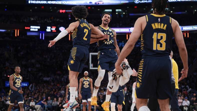 Apr 9, 2023; New York, New York, USA; Indiana Pacers guard George Hill (7) celebrates with guard Chris Duarte (3) and forward Jordan Nwora (13) after a basket during the second half against the New York Knicks at Madison Square Garden. Mandatory Credit: Vincent Carchietta-USA TODAY Sports