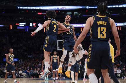 Apr 9, 2023; New York, New York, USA; Indiana Pacers guard George Hill (7) celebrates with guard Chris Duarte (3) and forward Jordan Nwora (13) after a basket during the second half against the New York Knicks at Madison Square Garden. Mandatory Credit: Vincent Carchietta-USA TODAY Sports