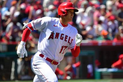 Apr 9, 2023; Anaheim, California, USA; Los Angeles Angels designated hitter Shohei Ohtani (17) runs after hitting a two run home run against the Toronto Blue Jays during the third inning  at Angel Stadium. Mandatory Credit: Gary A. Vasquez-USA TODAY Sports