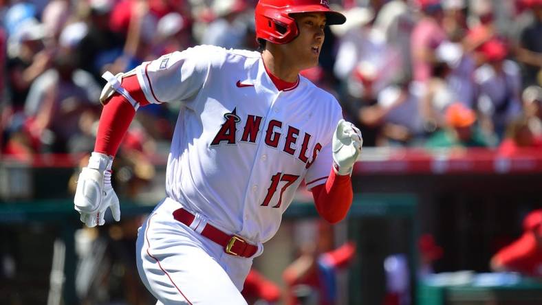 Apr 9, 2023; Anaheim, California, USA; Los Angeles Angels designated hitter Shohei Ohtani (17) runs after hitting a two run home run against the Toronto Blue Jays during the third inning  at Angel Stadium. Mandatory Credit: Gary A. Vasquez-USA TODAY Sports