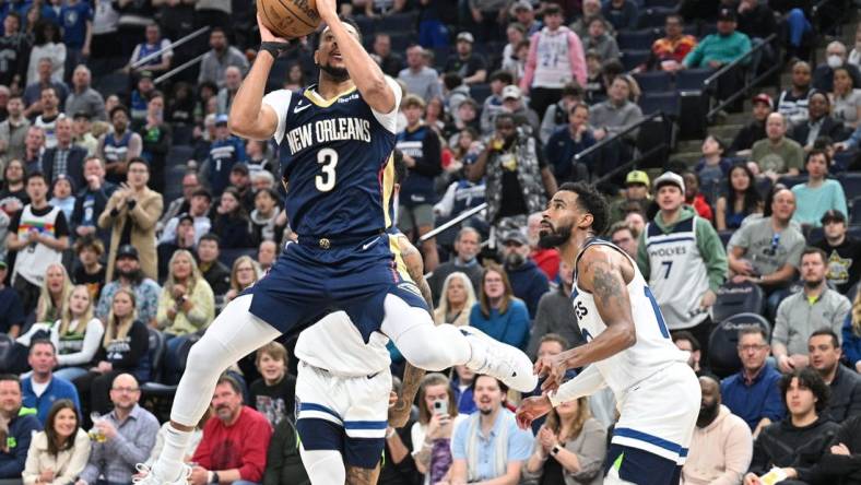 Apr 9, 2023; Minneapolis, Minnesota, USA; New Orleans Pelicans guard CJ McCollum (3) shoots the ball as Minnesota Timberwolves guard Mike Conley (10) looks on during the third quarter at Target Center. Mandatory Credit: Jeffrey Becker-USA TODAY Sports