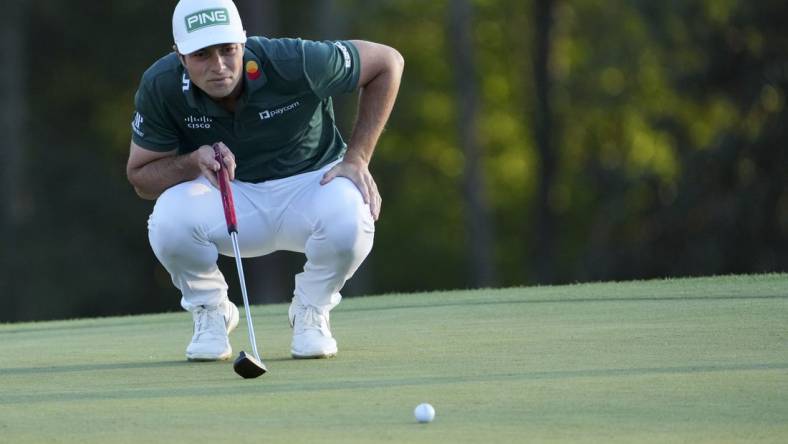 Apr 9, 2023; Augusta, Georgia, USA; Viktor Hovland lines up his putt on the 18th green during the final round of The Masters golf tournament. Mandatory Credit: Danielle Parhizkaran-USA TODAY Network