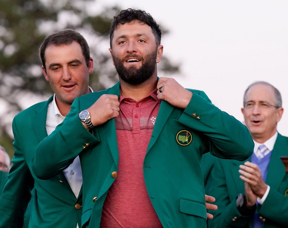 Scottie Scheffler (left) helps Jon Rahm into his green jacket after Rahm's Masters win.

Pga Masters Tournament Final Round