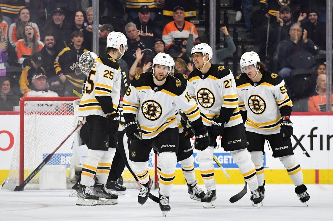 Bruins set NHL regular-season wins record, close in on points mark