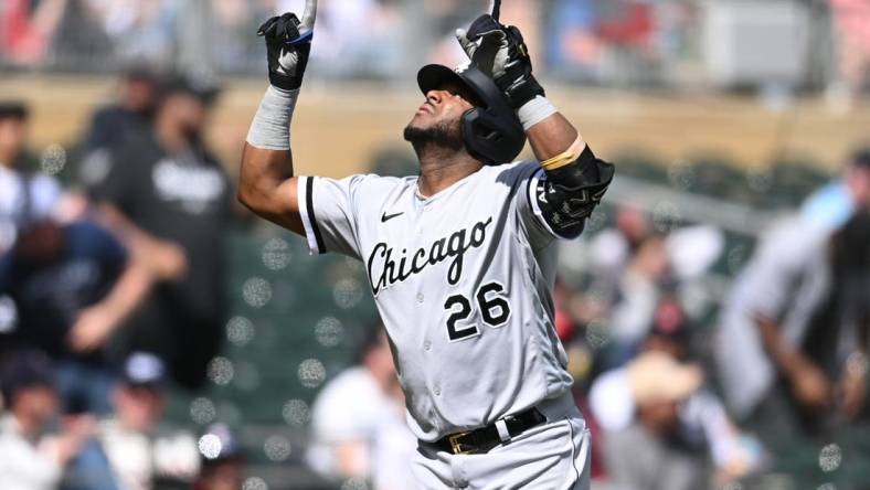 Apr 10, 2023; Minneapolis, Minnesota, USA; Chicago White Sox shortstop Hanser Alberto (26) reacts after hitting a three run home run against Minnesota Twins starting pitcher Kenta Maeda (not pictured) during the fourth inning at Target Field. Mandatory Credit: Jeffrey Becker-USA TODAY Sports