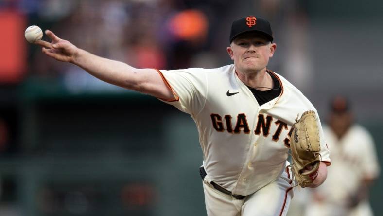 Apr 10, 2023; San Francisco, California, USA; San Francisco Giants starting pitcher Logan Webb (62) delivers a pitch against the Los Angeles Dodgers during the first inning at Oracle Park. Mandatory Credit: D. Ross Cameron-USA TODAY Sports