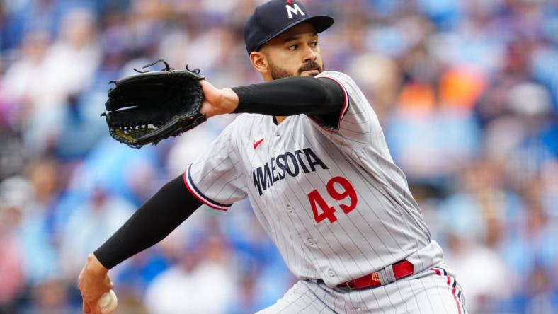 Mar 30, 2023; Kansas City, Missouri, USA; Minnesota Twins starting pitcher Pablo Lopez (49) pitches during the first inning against the Kansas City Royals at Kauffman Stadium. Mandatory Credit: Jay Biggerstaff-USA TODAY Sports