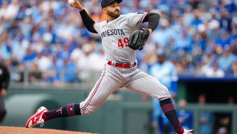 Mar 30, 2023; Kansas City, Missouri, USA; Minnesota Twins starting pitcher Pablo Lopez (49) pitches during the first inning against the Kansas City Royals at Kauffman Stadium. Mandatory Credit: Jay Biggerstaff-USA TODAY Sports