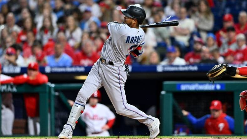 Apr 11, 2023; Philadelphia, Pennsylvania, USA; Miami Marlins second baseman Luis Arraez (3) hits a triple against the Philadelphia Phillies in the sixth inning at Citizens Bank Park. Mandatory Credit: Kyle Ross-USA TODAY Sports