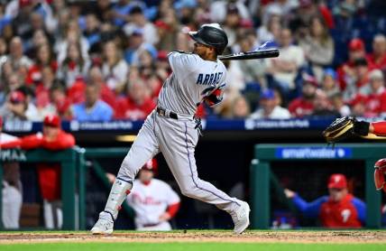 Apr 11, 2023; Philadelphia, Pennsylvania, USA; Miami Marlins second baseman Luis Arraez (3) hits a triple against the Philadelphia Phillies in the sixth inning at Citizens Bank Park. Mandatory Credit: Kyle Ross-USA TODAY Sports