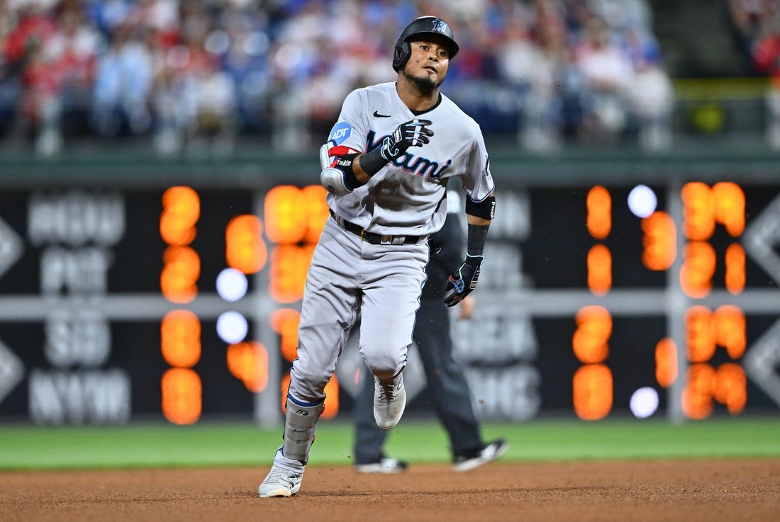 Miami Marlins' Jon Berti, left, Yuli Gurriel, center, and Luis