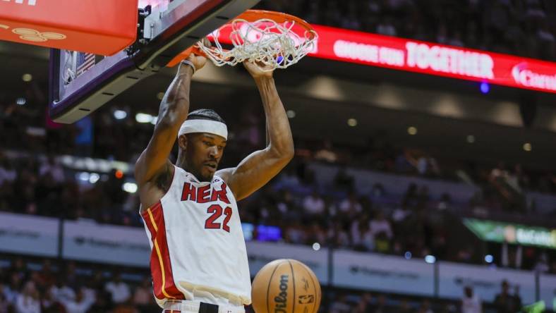 Apr 11, 2023; Miami, Florida, USA; Miami Heat forward Jimmy Butler (22) dunks the ball during the third quarter against the Atlanta Hawks at Kaseya Center. Mandatory Credit: Sam Navarro-USA TODAY Sports