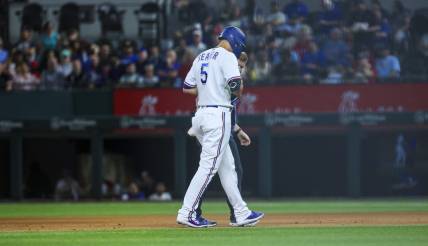 Apr 11, 2023; Arlington, Texas, USA;  Texas Rangers shortstop Corey Seager (5) leaves the game with an injury during the fifth inning against the Kansas City Royals at Globe Life Field. Mandatory Credit: Kevin Jairaj-USA TODAY Sports