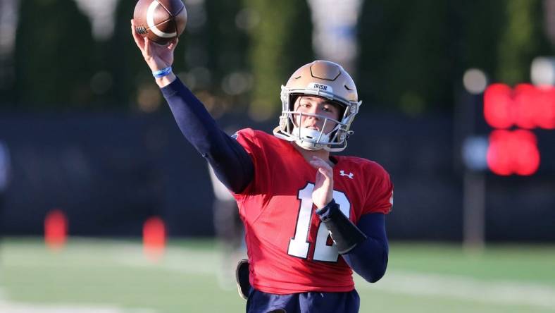 Notre Dame quarterback Tyler Buchner (12) throws a pass Wednesday, April 12, 2023, during spring football practice on the Notre Dame campus.

Nd Spring Football