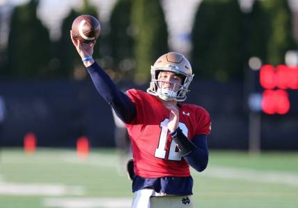 Notre Dame quarterback Tyler Buchner (12) throws a pass Wednesday, April 12, 2023, during spring football practice on the Notre Dame campus.

Nd Spring Football