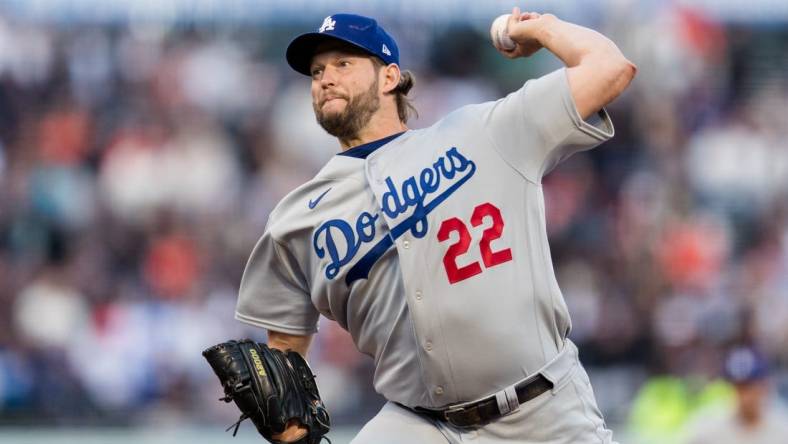 Apr 12, 2023; San Francisco, California, USA;  Los Angeles Dodgers starting pitcher Clayton Kershaw (22) throws against the San Francisco Giants during the first inning at Oracle Park. Mandatory Credit: John Hefti-USA TODAY Sports