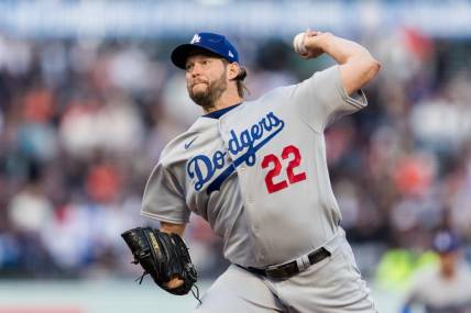 Apr 12, 2023; San Francisco, California, USA;  Los Angeles Dodgers starting pitcher Clayton Kershaw (22) throws against the San Francisco Giants during the first inning at Oracle Park. Mandatory Credit: John Hefti-USA TODAY Sports