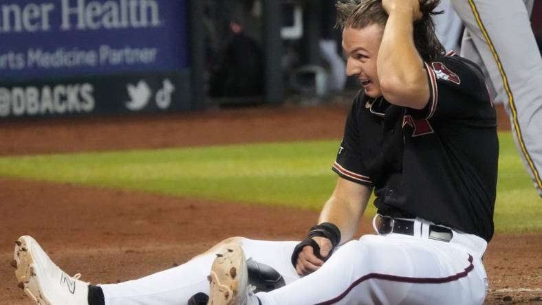 Arizona Diamondbacks' Jake McCarthy (31) reacts to being called out at home plate against the Milwaukee Brewers at Chase Field in Phoenix on April 12, 2023.

Mlb Brewers At D Backs