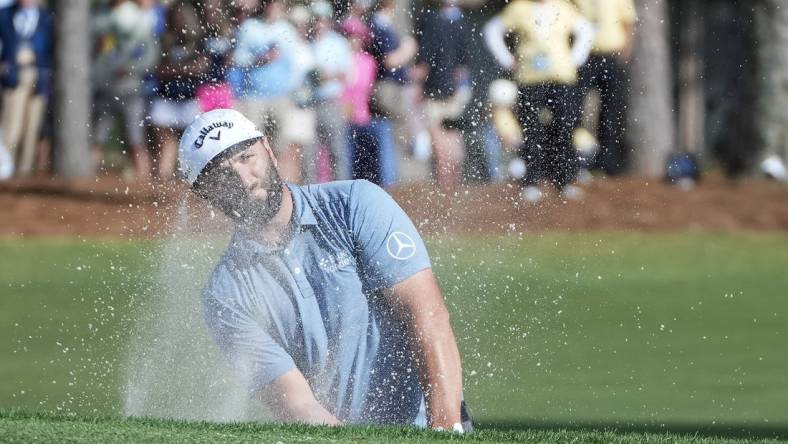 Apr 13, 2023; Hilton Head, South Carolina, USA; Jon Rahm plays from the bunker on the 9th hole during the first round of the RBC Heritage golf tournament. Mandatory Credit: David Yeazell-USA TODAY Sports