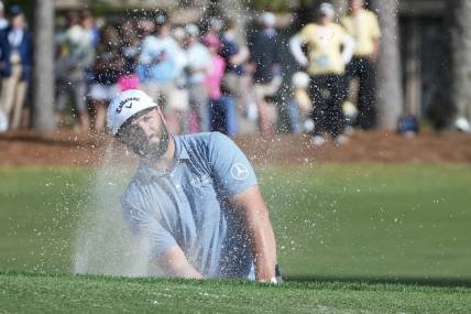 Apr 13, 2023; Hilton Head, South Carolina, USA; Jon Rahm plays from the bunker on the 9th hole during the first round of the RBC Heritage golf tournament. Mandatory Credit: David Yeazell-USA TODAY Sports