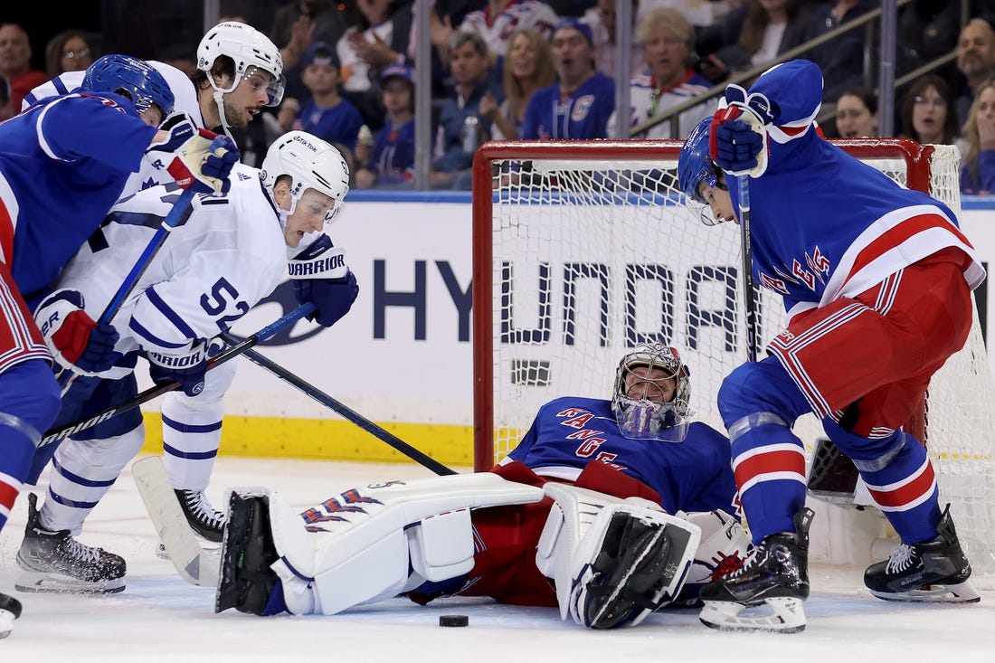 Apr 13, 2023; New York, New York, USA; New York Rangers goaltender Jaroslav Halak (41) makes a save against Toronto Maple Leafs center Noel Acciari (52) and center Auston Matthews (34) during the second period at Madison Square Garden. Mandatory Credit: Brad Penner-USA TODAY Sports