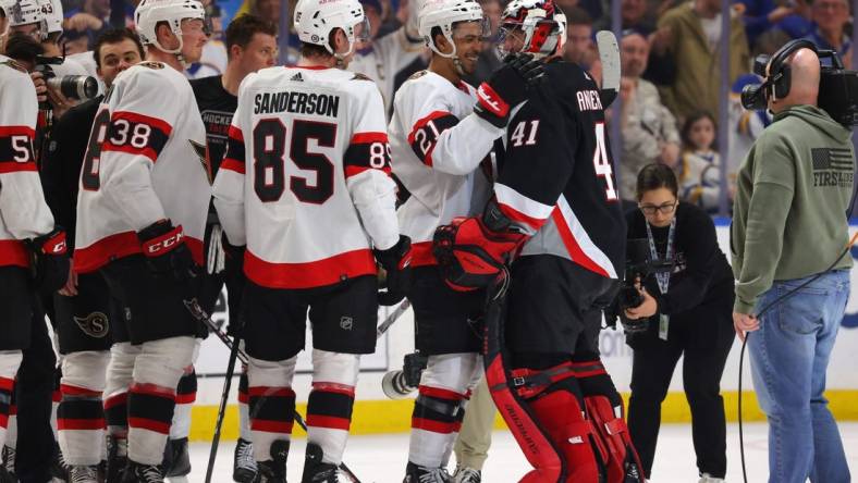 Apr 13, 2023; Buffalo, New York, USA;  Ottawa Senators players congratulate Buffalo Sabres goaltender Craig Anderson (41) on his last game at KeyBank Center. Mandatory Credit: Timothy T. Ludwig-USA TODAY Sports