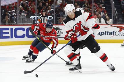 Apr 13, 2023; Washington, District of Columbia, USA; New Jersey Devils defenseman Dougie Hamilton (7) skates with the puck as Washington Capitals left wing Conor Sheary (73) chases in the first period at Capital One Arena. Mandatory Credit: Geoff Burke-USA TODAY Sports