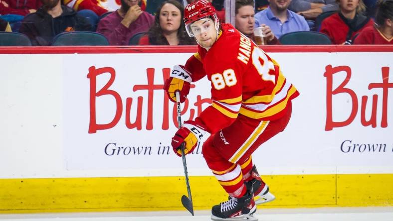 Apr 12, 2023; Calgary, Alberta, CAN; Calgary Flames left wing Andrew Mangiapane (88) controls the puck against the San Jose Sharks during the second period at Scotiabank Saddledome. Mandatory Credit: Sergei Belski-USA TODAY Sports