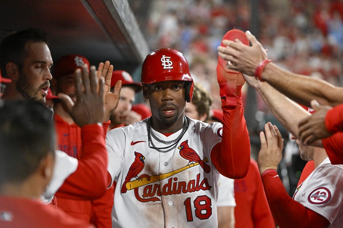 Apr 14, 2023; St. Louis, Missouri, USA;  St. Louis Cardinals pinch runner Jordan Walker (18) is congratulated by teammates after scoring against the Pittsburgh Pirates during the eighth inning at Busch Stadium. Mandatory Credit: Jeff Curry-USA TODAY Sports