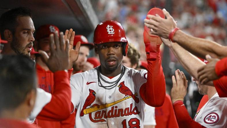 Apr 14, 2023; St. Louis, Missouri, USA;  St. Louis Cardinals pinch runner Jordan Walker (18) is congratulated by teammates after scoring against the Pittsburgh Pirates during the eighth inning at Busch Stadium. Mandatory Credit: Jeff Curry-USA TODAY Sports