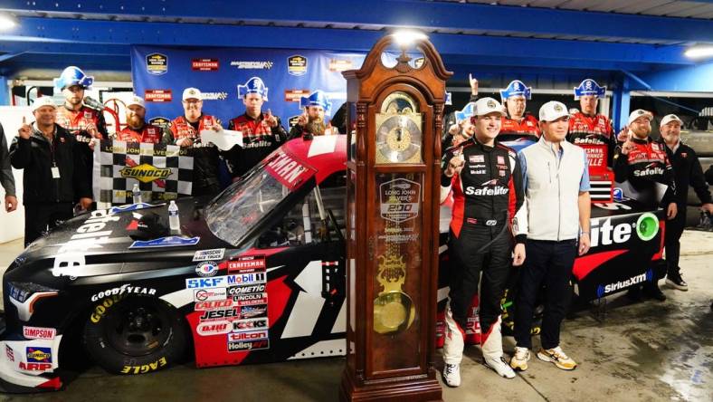 Apr 14, 2023; Martinsville, Virginia, USA; NASCAR Truck Series driver Corey Heim (11) celebrates his victory in the rain shortened race in the Long John Silver's 200 at Martinsville Speedway. Mandatory Credit: John David Mercer-USA TODAY Sports