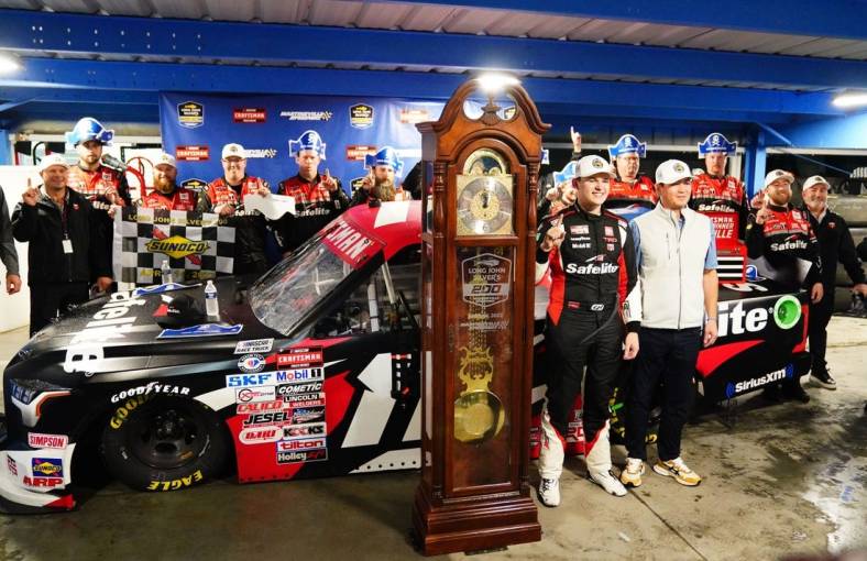 Apr 14, 2023; Martinsville, Virginia, USA; NASCAR Truck Series driver Corey Heim (11) celebrates his victory in the rain shortened race in the Long John Silver's 200 at Martinsville Speedway. Mandatory Credit: John David Mercer-USA TODAY Sports