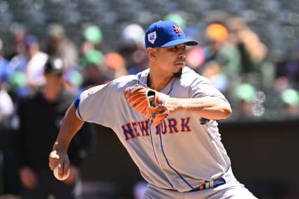 Apr 15, 2023; Oakland, California, USA; New York Mets starting pitcher Carlos Carrasco (59) throws against the Oakland Athletics during the first inning at RingCentral Coliseum. Mandatory Credit: Robert Edwards-USA TODAY Sports