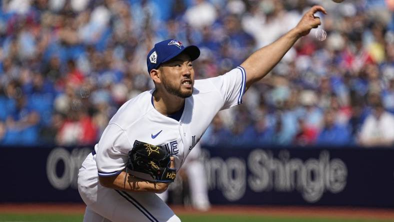 Apr 15, 2023; Toronto, Ontario, CAN; Toronto Blue Jays pitcher Yusei Kikuchi pitches to the Tampa Bay Rays during the first inning on Jackie Robinson day at Rogers Centre. Mandatory Credit: John E. Sokolowski-USA TODAY Sports