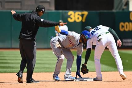 Apr 15, 2023; Oakland, California, USA; New York Mets right fielder Starling Marte (6) calls for time and umpire Gabe Morales (47) makes the call of safe during the sixth inning at RingCentral Coliseum. Mandatory Credit: Robert Edwards-USA TODAY Sports
