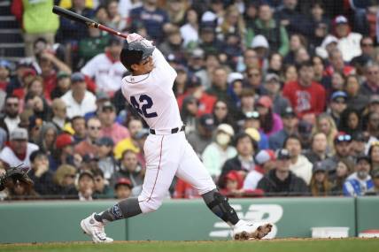 Apr 15, 2023; Boston, Massachusetts, USA; Boston Red Sox short stop Yu Chang (20) hits a two run home run during the fourth inning against the Los Angeles Angels at Fenway Park. Mandatory Credit: Bob DeChiara-USA TODAY Sports