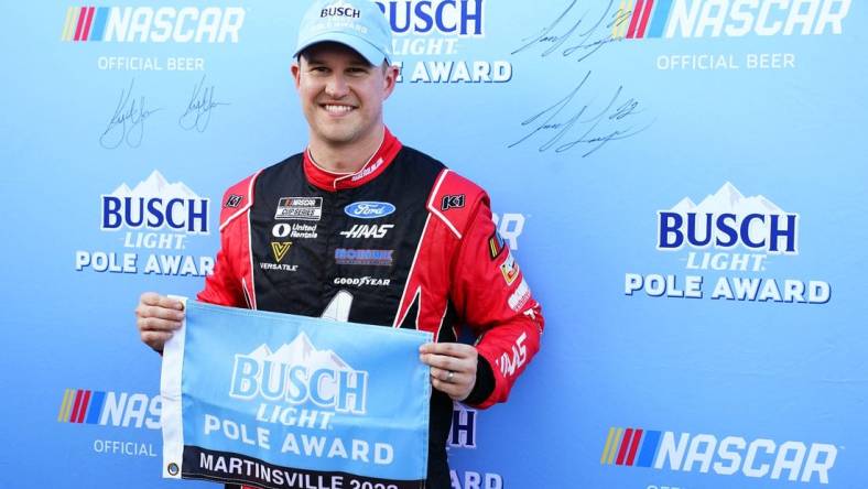 Apr 15, 2023; Martinsville, Virginia, USA; NASCAR Cup Series driver Ryan Preece (41) holds the pole award flag after capturing the pole during qualifying at Martinsville Speedway. Mandatory Credit: John David Mercer-USA TODAY Sports