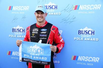 Apr 15, 2023; Martinsville, Virginia, USA; NASCAR Cup Series driver Ryan Preece (41) holds the pole award flag after capturing the pole during qualifying at Martinsville Speedway. Mandatory Credit: John David Mercer-USA TODAY Sports