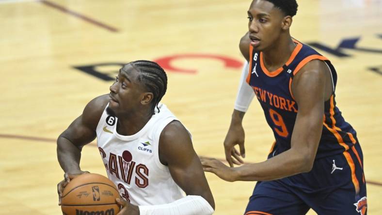 Apr 15, 2023; Cleveland, Ohio, USA; Cleveland Cavaliers guard Caris LeVert (3) drives past New York Knicks guard RJ Barrett (9) in the second quarter of game one of the 2023 NBA playoffs at Rocket Mortgage FieldHouse. Mandatory Credit: David Richard-USA TODAY Sports