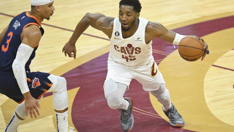 Apr 15, 2023; Cleveland, Ohio, USA; Cleveland Cavaliers guard Donovan Mitchell (45) dribbles beside New York Knicks guard Josh Hart (3) in the second quarter of game one of the 2023 NBA playoffs at Rocket Mortgage FieldHouse. Mandatory Credit: David Richard-USA TODAY Sports