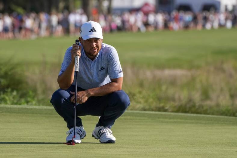 Apr 15, 2023; Hilton Head, South Carolina, USA; Xander Schauffele lines up a putt on the 18th green during the third round of the RBC Heritage golf tournament. Mandatory Credit: David Yeazell-USA TODAY Sports