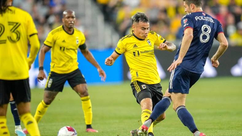 Apr 15, 2023; Columbus, Ohio, United States;  New England Revolution midfielder Matt Polster (8) kicks the ball away from Columbus Crew midfielder Lucas Zelarayan (10) during the first half of the MLS soccer game between Columbus Crew and New England Revolution at Lower.com Field on Saturday evening. Mandatory Credit: Joseph Scheller-The Columbus Dispatch

Mls Ceb Crew New England New England At Crew