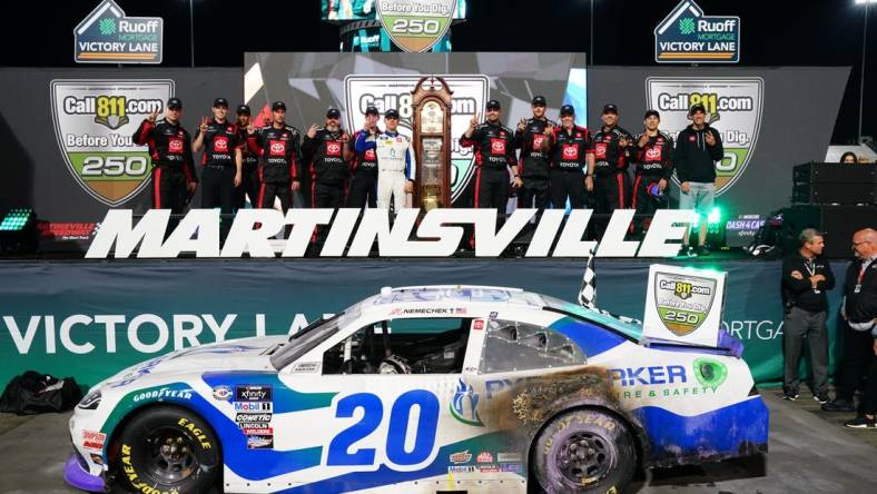 Apr 15, 2023; Martinsville, Virginia, USA; Xfinity Series driver John Hunter Nemechek (20) celebrates winning the Call 811.com Before You Dig 250 at Martinsville Speedway. Mandatory Credit: John David Mercer-USA TODAY Sports